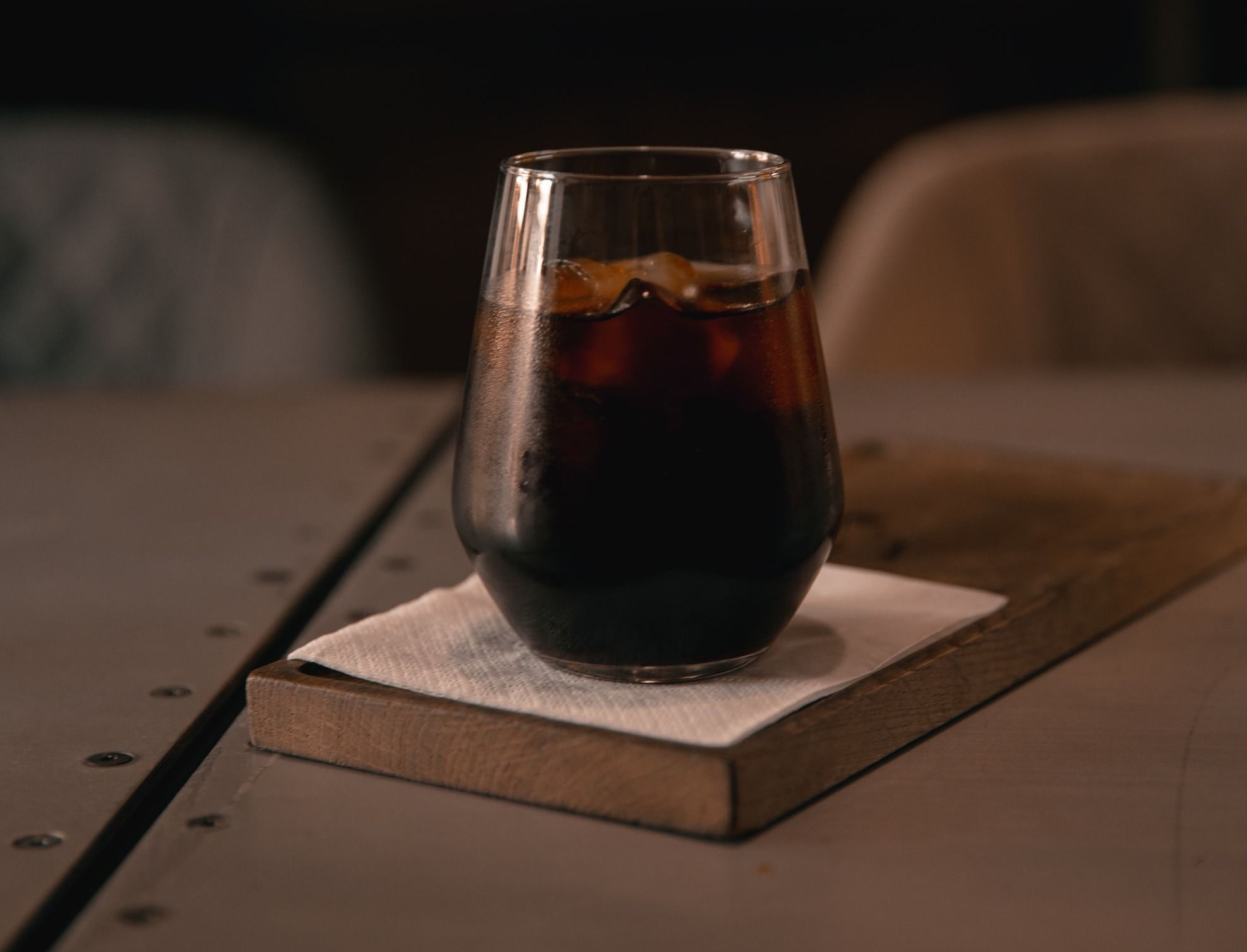 clear drinking glass on brown wooden table